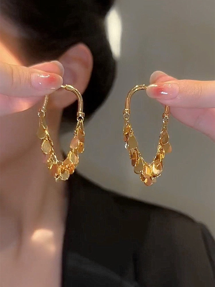 48. Aretes de lentejuelas vibrantes (oro) 